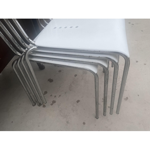 2668 - FOUR RETRO STYLE WHITE PLASTIC AND CHROME STACKING KITCHEN CHAIRS