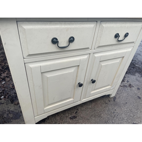 2675 - A MODERN OAK AND CREAM SIDEBOARD WITH TWO DOORS AND TWO DRAWERS - 99 CM X 47 CM X 85 CM HIGH