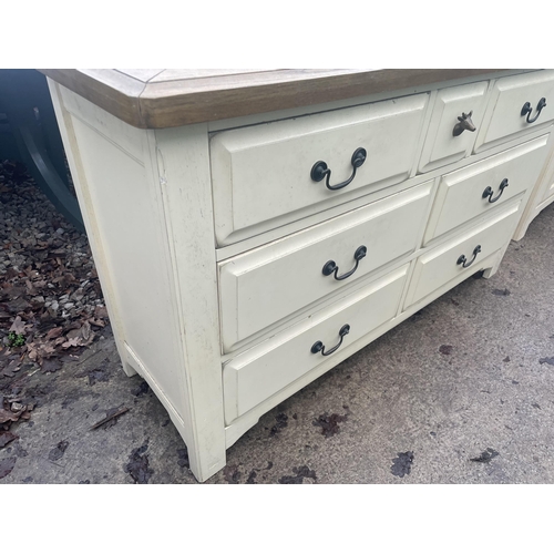 2676 - A MODERN OAK AND CREAM  CHEST OF SEVEN DRAWERS - 135 CM X 43 CM X 80 CM HIGH