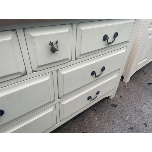 2676 - A MODERN OAK AND CREAM  CHEST OF SEVEN DRAWERS - 135 CM X 43 CM X 80 CM HIGH