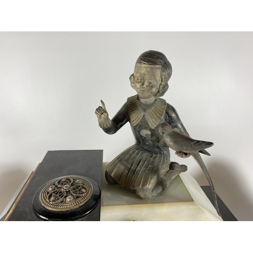 91 - AN ART DECO MANTLE CLOCK WITH GIRL WITH BIRD FINIAL DESIGN AND SIDE GARNITURES