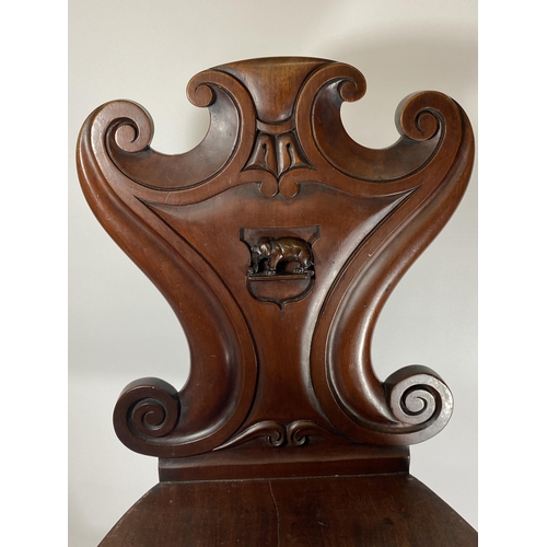 21 - A 19TH CENTURY MAHOGANY CARVED BEDROOM CHAIR WITH ELEPHANT DESIGN BACK