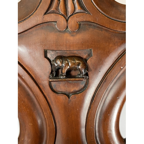 21 - A 19TH CENTURY MAHOGANY CARVED BEDROOM CHAIR WITH ELEPHANT DESIGN BACK