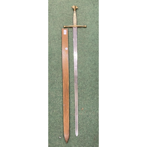 63 - A VINTAGE BONE STYLE HANDLED SWORD WITH WOODEN SCABBARD