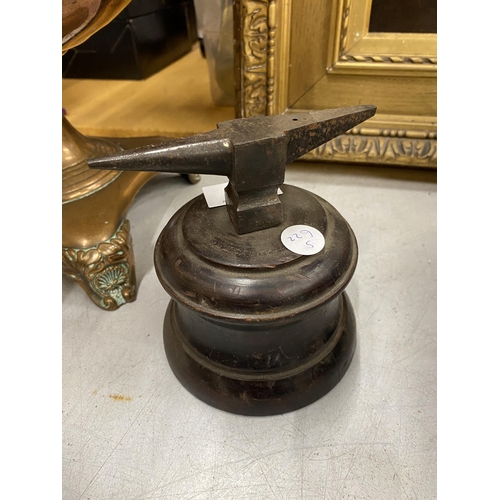 70 - A METAL MINIATURE ANVIL ON WOODEN BASE