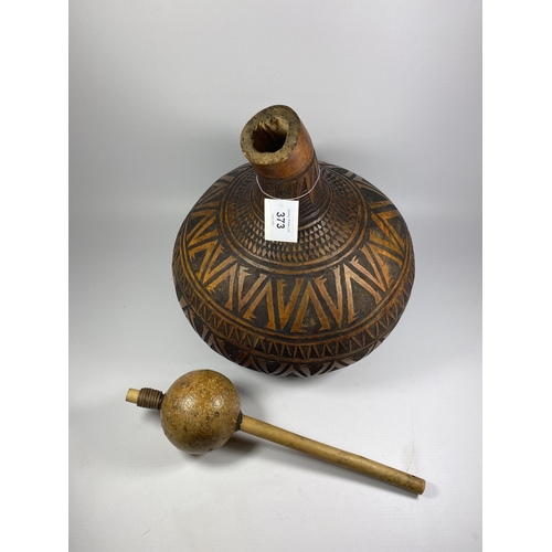 373 - A VINTAGE TRIBAL CARVED WOODEN POPPY SEED GOURD AND SHAKER, HEIGHT