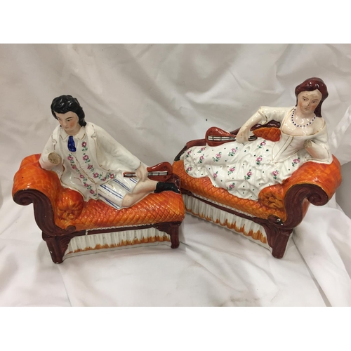 108 - A LARGE VICTORIAN STAFFORDSHIRE LORD KITCHENER AND A PAIR OF FIGURES ON CHAISE LONGUES - BOTH A/F