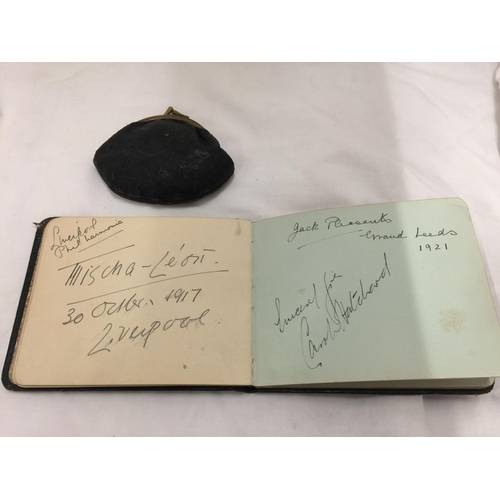 111 - A VINTAGE AUTOGRAPH ALBUM AND A PURSE CONTAINING A QUANTITY OF VINTAGE FOREIGN COINS