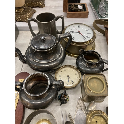 164 - A LARGE QUANTITY OF BRASS ITEMS TO INCLUDE CLOCKS, BAROMETERS, FLATWARE, A TEASET, TANKARD, ETC