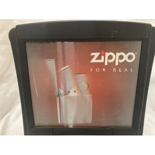 169 - A 'ZIPPO LIGHTER' SHOP SIGN - WORKING AT CATALOGUING