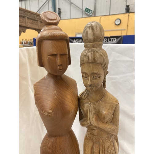 177 - TWO HAND CARVED ORIENTAL STYLE FIGURES OF LADIES HEIGHT 64CM AND 67CM