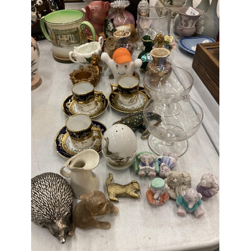 180 - A MIXED LOT TO INCLUDE SMALL CUPS AND SAUCERS, ANIMAL FIGURES, GLASSWARE, A DOULTON MUG, ETC