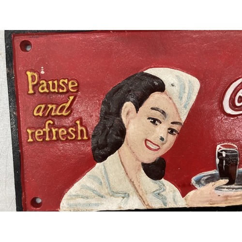 184 - A 'DRINK COCA-COLA' CAST SIGN 30CM X 15CM