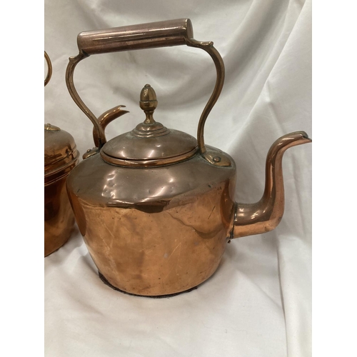 191 - TWO LARGE COPPER KETTLES WITH ACORN FINIALS