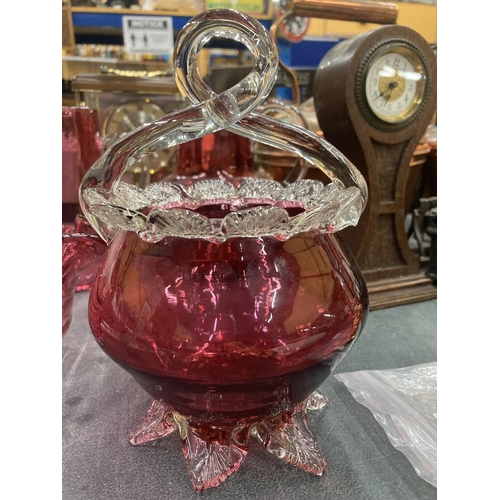 195 - A PAIR OF CRANBERRY GLASS JUGS HEIGHT 16CM