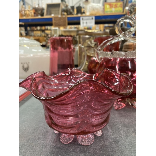 195 - A PAIR OF CRANBERRY GLASS JUGS HEIGHT 16CM