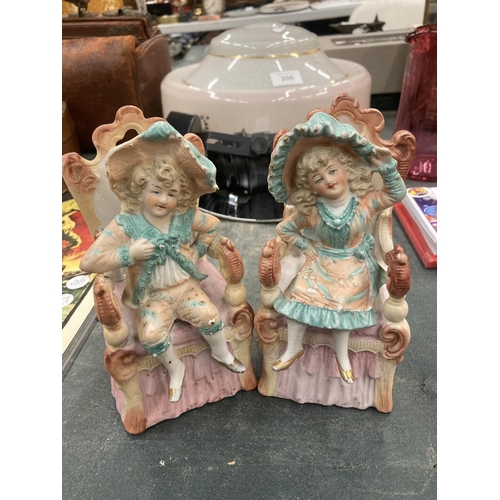 198 - A PAIR OF BISQUE CONTINENTAL SEATED FIGURES