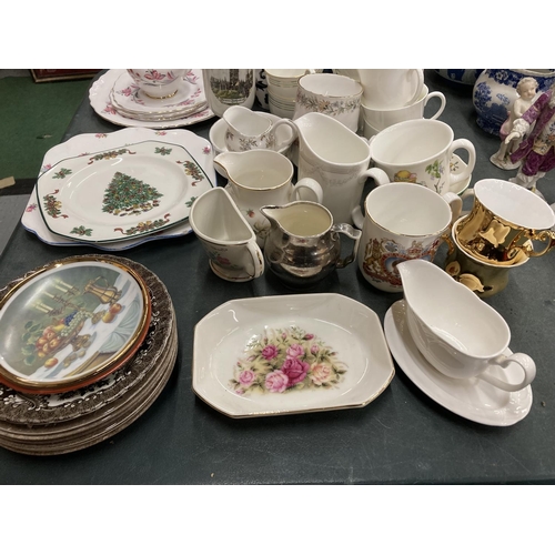 210 - A LARGE QUANTITY OF MUGS, CUPS AND PLATES TO INCLUDE A JOHNSON BROS CHRISTMAS PLATE