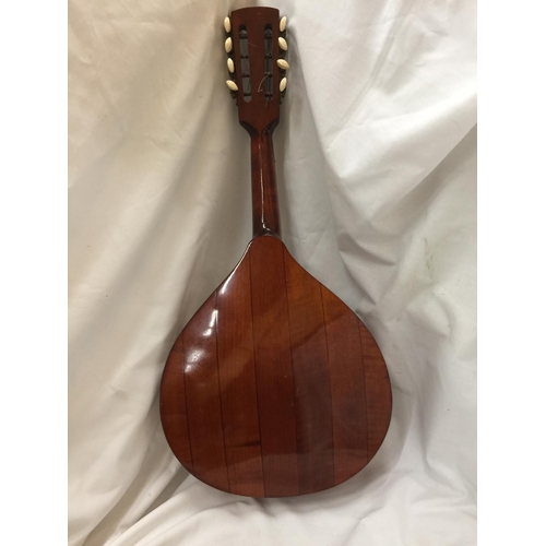 225 - A VINTAGE INLAID MANDOLIN WITH A PLECTRUM