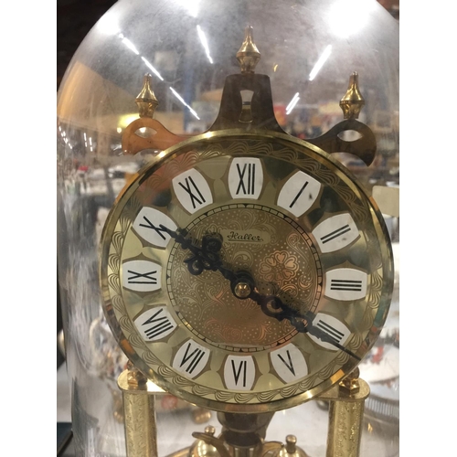 228 - A GERMAN MANTLE CLOCK IN A GLASS DOME