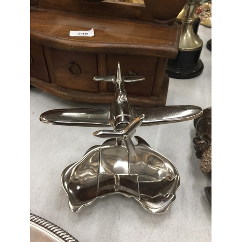 252 - A MODEL OF A CHROME SPITFIRE ON A DISH HEIGHT 15CM