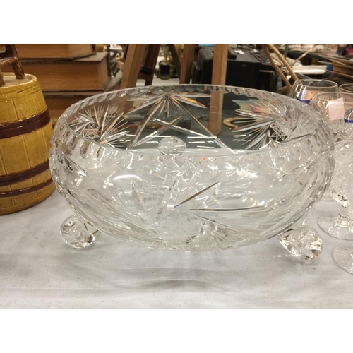 261 - A LARGE CUT GLASS CRYSTAL FOOTED BOWL AND A SMALLER BOWL