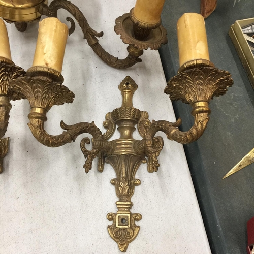 272 - AN ORNATE BRASS CEILING LAMP WITH THREE CANDLE BRANCHES PLUS A MATCHING PAIR OF WALL LIGHTS