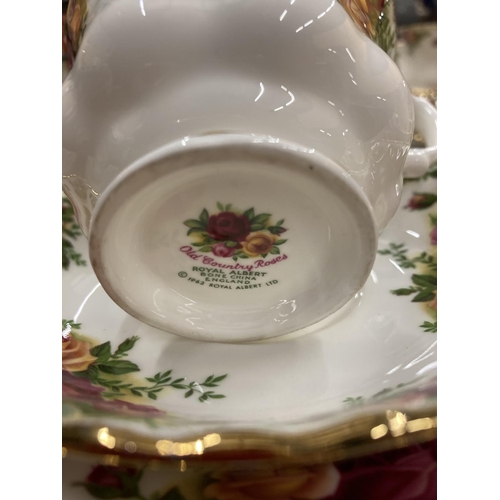 287 - A QUANTITY OF ROYAL ALBERT 'COLD COUNTRY ROSES' TO INCLUDE CUPS, SAUCERS, SIDE PLATES, A CREAM JUG, ... 