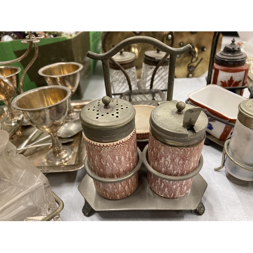 288 - A QUANTITY OF CRUET SETS IN WHITE METAL AND BRASS HOLDERS