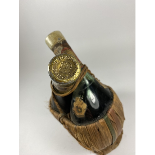 400A - A RARE 1947 CHIANTI TWIN RED / WHITE WINE BOTTLE IN BAMBOO HOLDER