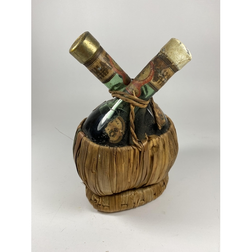 400A - A RARE 1947 CHIANTI TWIN RED / WHITE WINE BOTTLE IN BAMBOO HOLDER