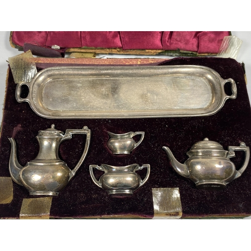 100 - A MINIATURE 1920'S HALLMARKED SILVER TEA SET IN CASE (CASE A/F)