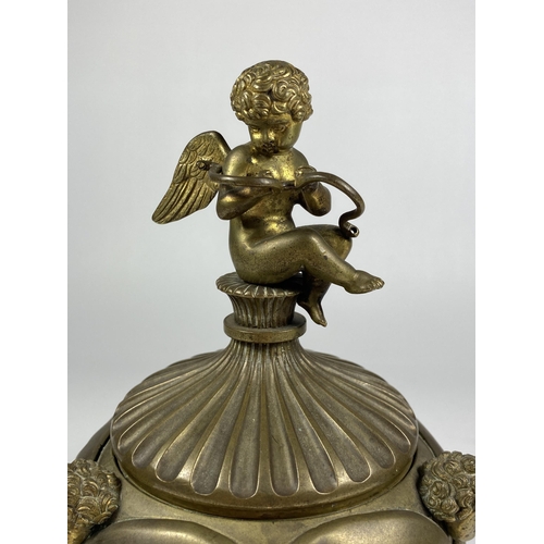 95 - A 19TH CENTURY BRASS PETRARCH'S INKSTAND WITH CHERUB DESIGN, INSRIBED TO UNDERISDE OF LID