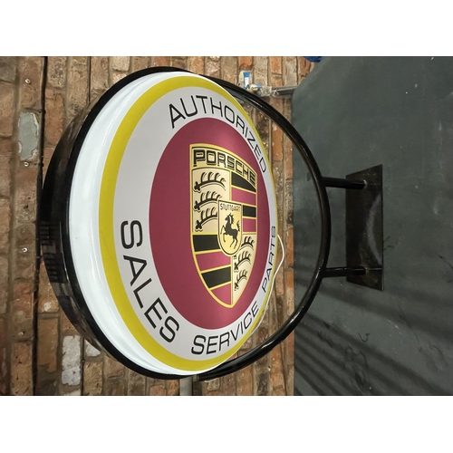 100A - A LARGE PORSCHE ILLUMINATED DOUBLE SIDED ROTATING SIGN WITH BRACKET WORKING AT THE TIME OF CATALOGUI... 