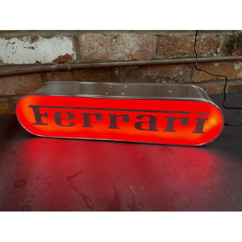 220A - A FERRARI ILLUMINATED LIGHT BOX SIGN - WORKING ORDER AT TIME OF CATALOGUING.  WIDTH 44CM, HEIGHT 10.... 