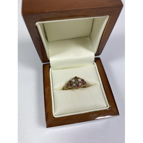 53 - A 9CT YELLOW GOLD RUBY & SEED PEARL CLUSTER RING, BOXED, SIZE K/L, WEIGHT 2.34G