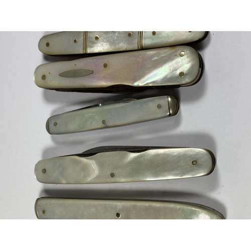 57 - A SET OF TEN VINTAGE MOTHER OF PEARL FRUIT KNIVES