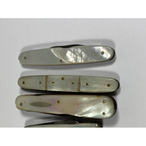 57 - A SET OF TEN VINTAGE MOTHER OF PEARL FRUIT KNIVES