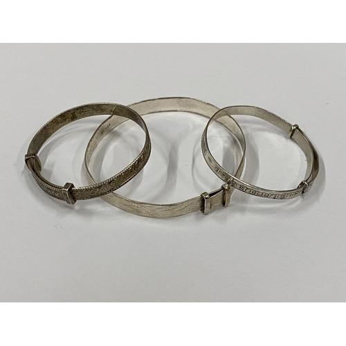 42 - THREE VINTAGE SILVER CHILD'S BANGLES