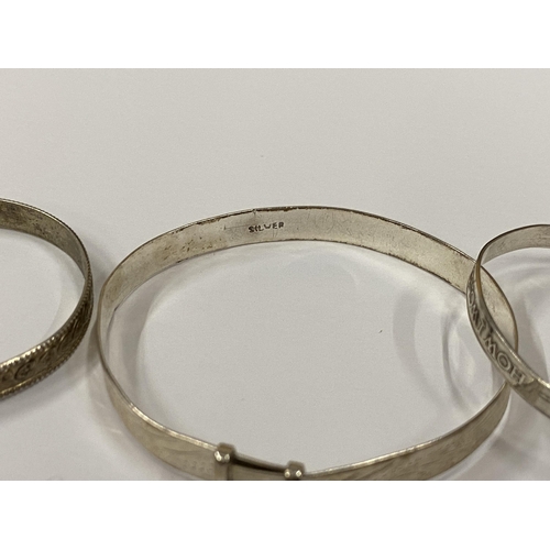 42 - THREE VINTAGE SILVER CHILD'S BANGLES