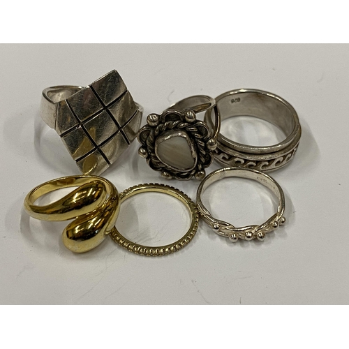 45 - SIX ASSORTED SILVER RINGS