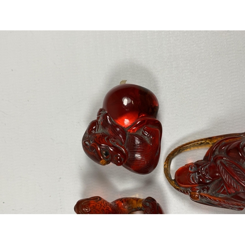 386 - THREE VINTAGE ORIENTAL GLASS NETSUKE FIGURES