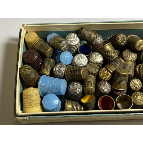 A BOX OF VINTAGE THIMBLES