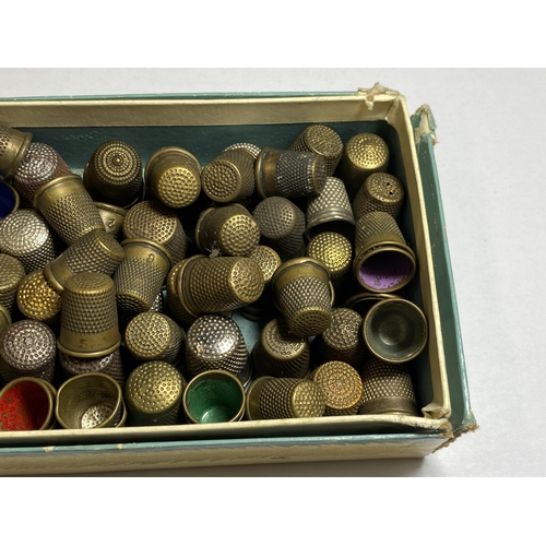 A BOX OF VINTAGE THIMBLES
