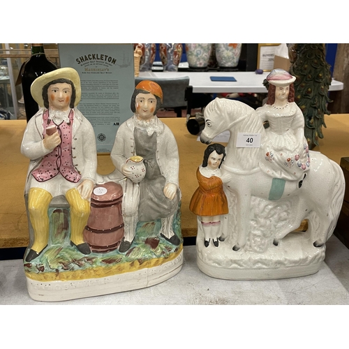 40 - A PAIR OF LARGE STAFFORDSHIRE POTTERY FIGURES