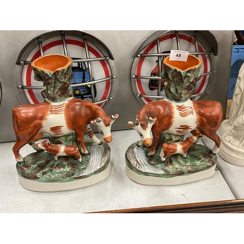 48 - A PAIR OF 19TH CENTURY STAFFORDSHIRE POTTERY COW SPILL VASES