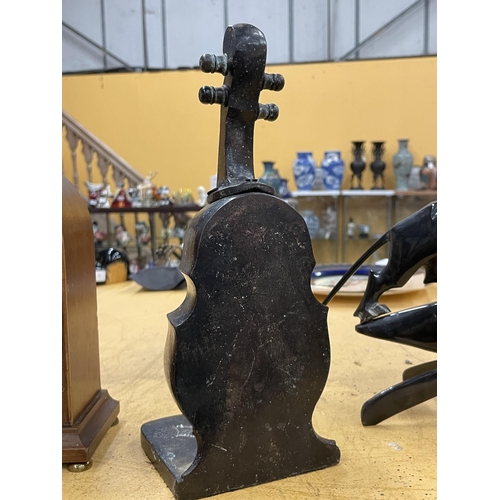 57 - A BRONZE DOUBLE BASS DOOR STOP