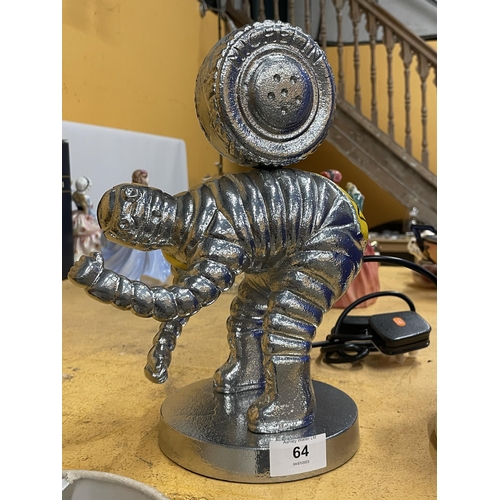 64 - A CHROME EFFECT MODEL OF A MICHELIN MAN WITH TYRE