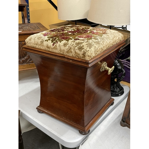 69 - A MAHOGANY OTTOMAN ON BUN FEET WITH BRASS HANDLES AND FLORAL EMBROIDERED SEAT