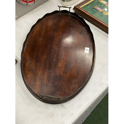 79 - AN EARLY 20TH CENTURY MAHOGANY BUTLER'S TRAY WITH GALLERY SIDES AND BRASS HANDLES